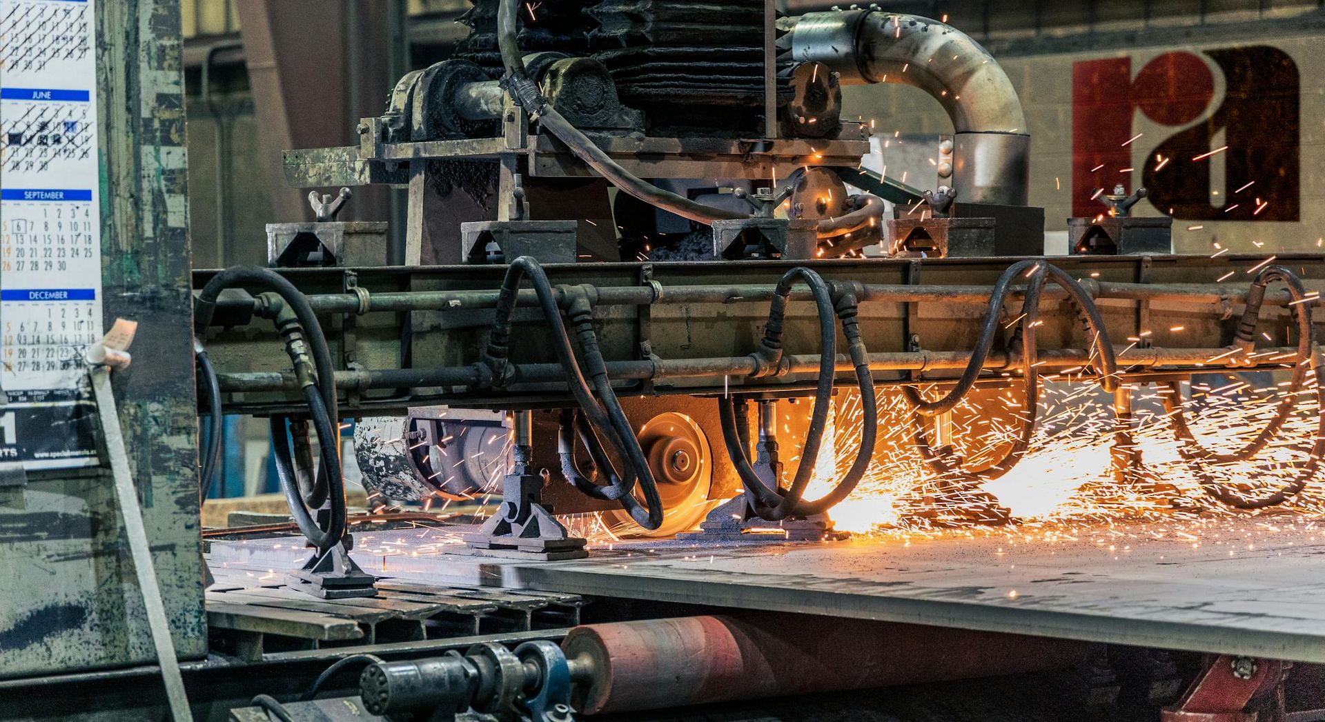 Industrial cutting process with visible sparks on the production line